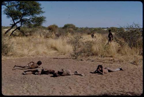 Children, Groups, play: Boys playing, rolling in the dust in a dance circle area