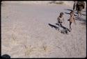 Children, Groups, play: Two children standing, viewed from a high angle