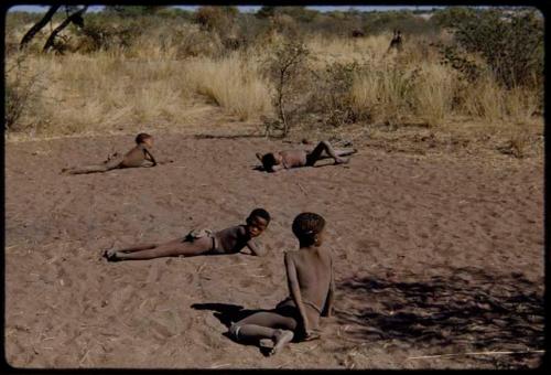 Children, Groups, play: Boys playing, rolling in the dust in a dance circle area