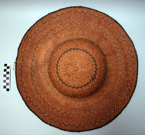 Twined hat. Sun hat shape w/ wide brim. Bands of zigzags around hat
