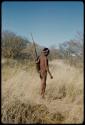 Hunting: Man standing, carrying his hunting bag over his shoulder