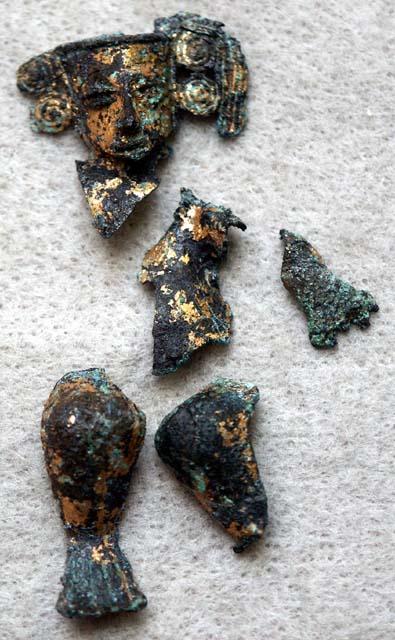 12 fragments of gold human figurine