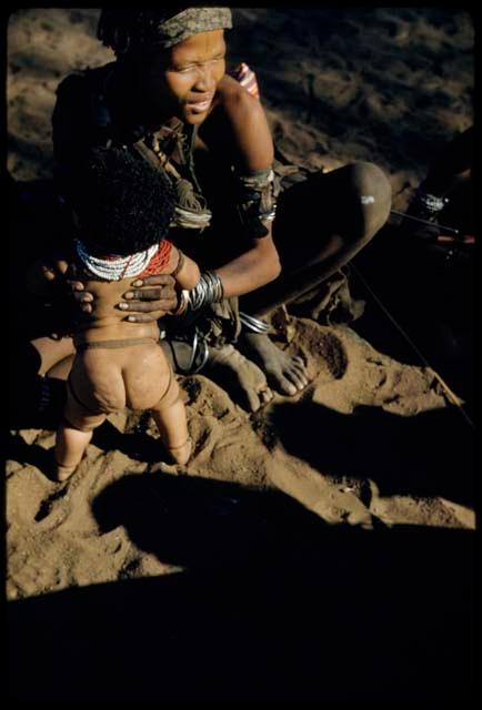 Physical Type: Woman sitting and holding a baby