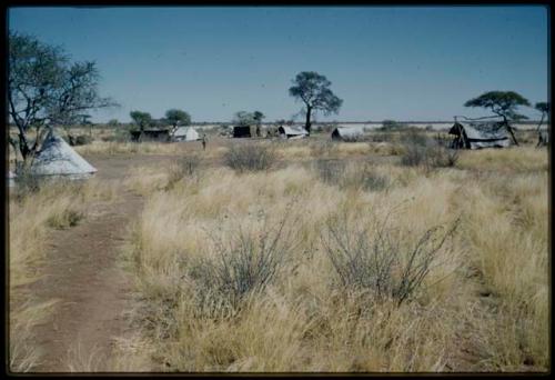 Expedition, Camp: Tents and cooking area in the expedition camp at Gautscha, after a veld fire