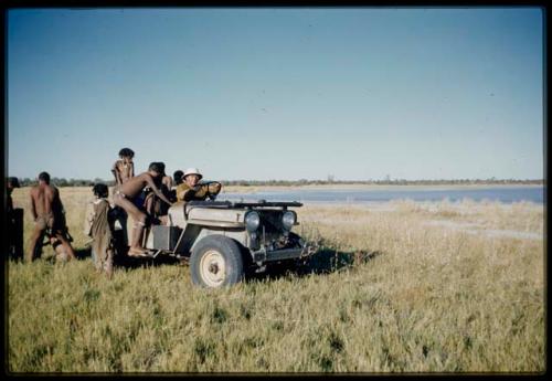 Expedition, Personnel: People standing on and near the expedition Jeep, with Laurence Marshall driving it