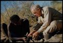 Expedition, Personnel: "Old Gau" watches Laurence Marshall making a hole in his shoe with an awl