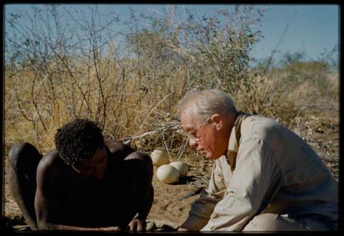 Expedition, Personnel: "Old Gau" watches Laurence Marshall making a hole in his shoe with an awl