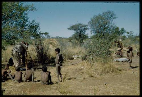 Expedition, Photography: Group of boys watching Laurence Marshall photograph something in the werft