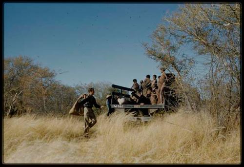 Expedition, Trucks: Group of people standing in the back of an expedition truck, with Heiner Kretzchmar loading something into it