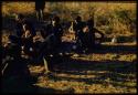 Expedition, Ethnographic work: Group of people sitting, with Lorna Marshall holding a baby