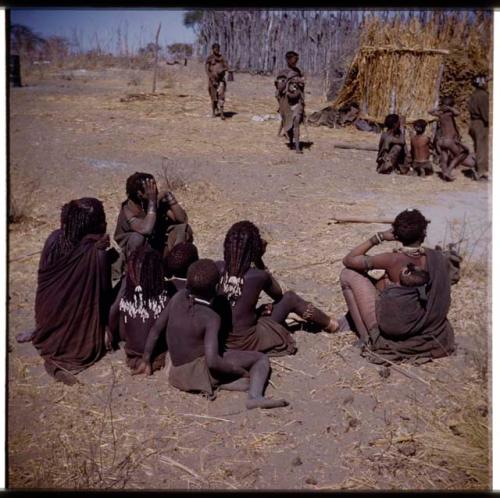 Ju/'hoan women sitting with Kwangali women from Makiena's group (half of stereo 2001.29.12121)