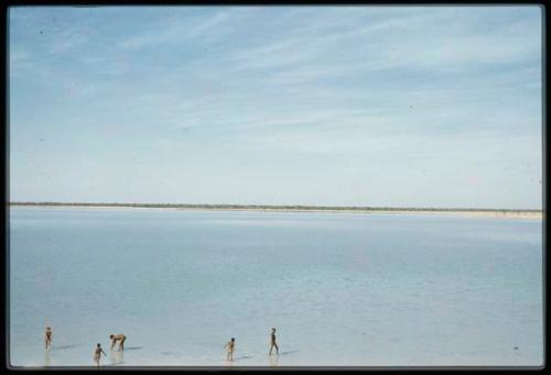 Scenery, Pan: People standing and walking in the water in the pan at Thinthuma