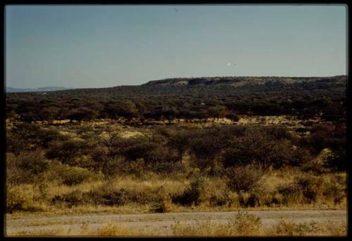 Scenery, Mountains: Omuramba, with blue hills in the distance, view from a road