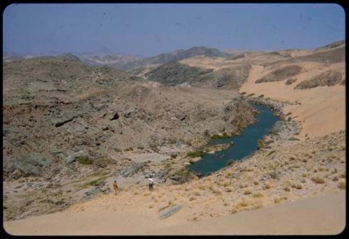 View of the Kunene River from a sand dune, with Angola mountains in the background