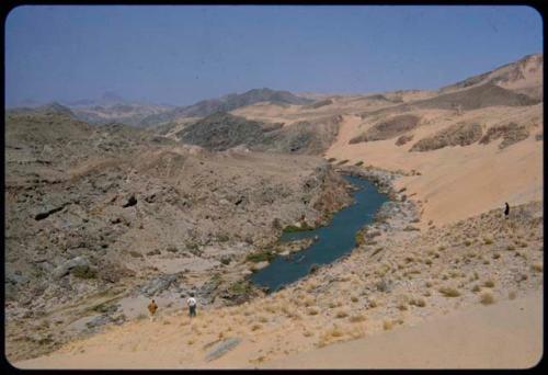 View of the Kunene River from a sand dune, with Angola mountains in the background