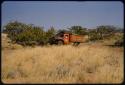 Expedition truck (Dodge) parked in brush at an expedition camp site on the west side of the Hartmann Mountains