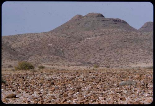 Landscape with rocks, hill in the distance, west of the Hartmann Mountains, looking east