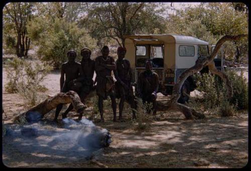 Mukolovandi sitting in the expedition camp with a group of people visiting