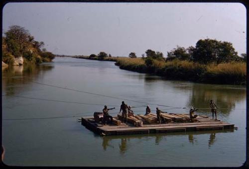 Men pulling on the pont cables, crossing the Kunene River