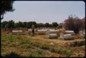 People looking at graves on a farm near Humpata