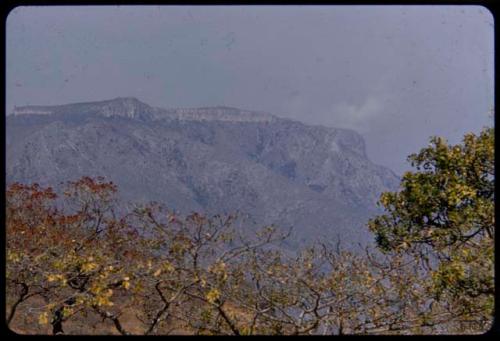 Smoke coming from a supposedly uninhabited point on an escarpment