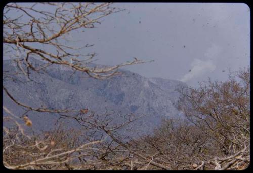 Smoke coming from a supposedly uninhabited point on an escarpment