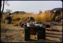 Man sitting in the expedition camp at an experimental farm