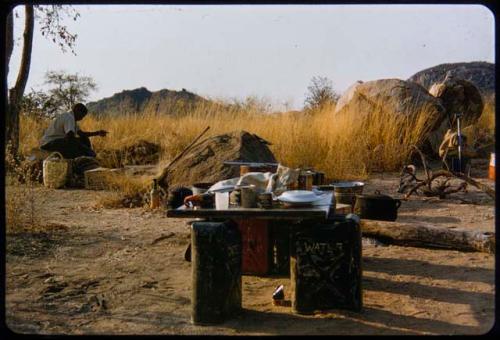 Man sitting in the expedition camp at an experimental farm