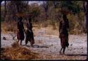 Women walking, carrying baskets on their heads