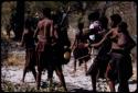 Group of people walking to take care of goat meat