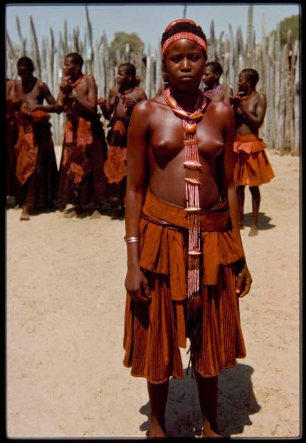 One of the wives of Chief Nehemiah wearing necklaces