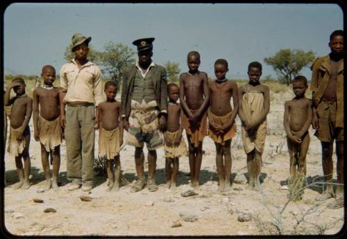 Group of men and children standing in a line