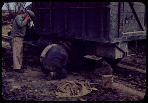 Expedition members repairing an expedition truck (Dodge)