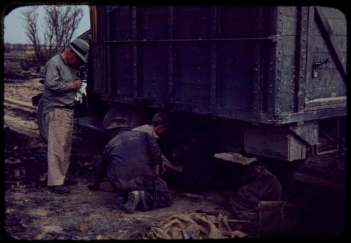 Expedition members repairing an expedition truck (Dodge)