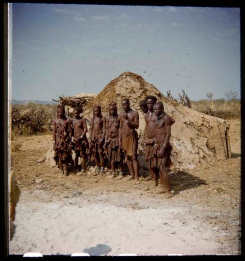 Group of people standing in line to have their photographs taken