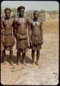 Three men standing in line to have their photographs taken