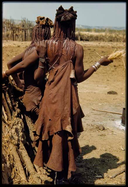 Woman wearing a collar, necklace, bracelet and anklet