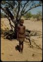 Boy standing in front of a tree