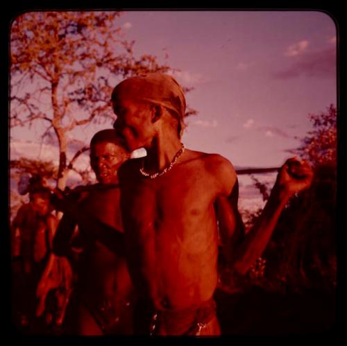 Two men in the middle of a curing dance