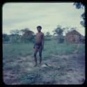 Man standing, with modern and old skerms in the background