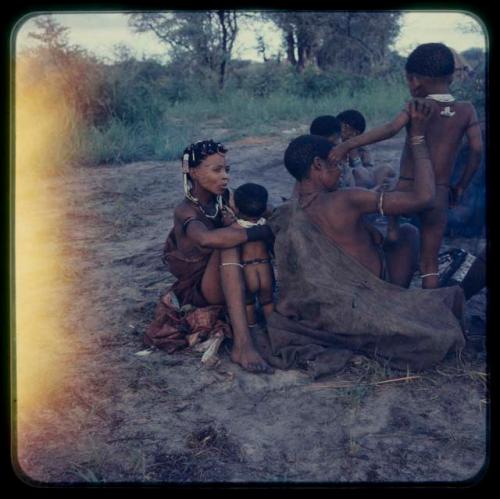 Group of women and children sitting