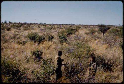 /Gishay and Simon Molamo talking in the grass