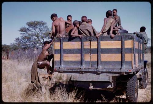 People climbing on a Marshall Expedition truck