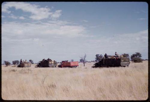 Marshall Expedition trucks driving in the grass