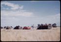 Marshall Expedition trucks driving in the grass