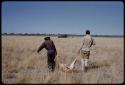 Dabe and William Donnellan walking with a springbok