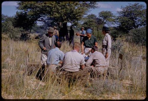 Marshall Expedition members, including John Marshall, Elizabeth Marshall Thomas, Lorna Marshall, Daniel Blitz, and L. F. Maingard eating lunch