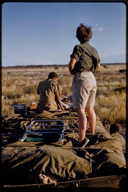 Elizabeth Marshall Thomas and an Expedition member on top of a truck