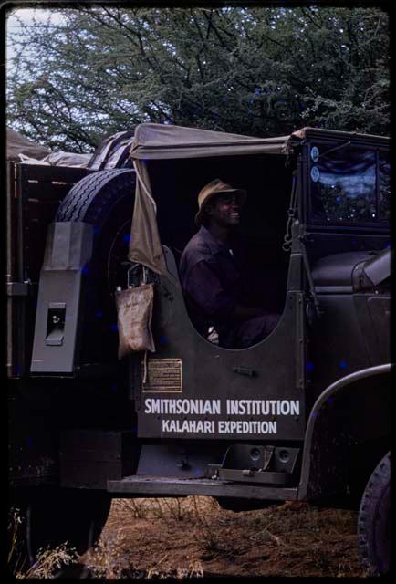 Kernel Ledimo sitting in the cab of the GMC truck