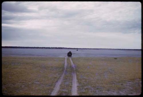 Trucks on the road, in the distance